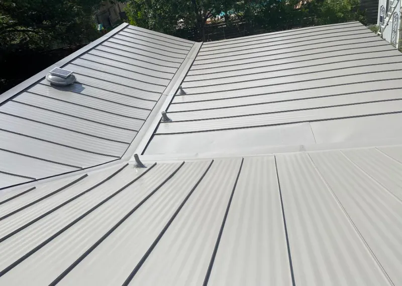 Solar attic fan installed on a metal roof for Roof Ventilation in Roseville